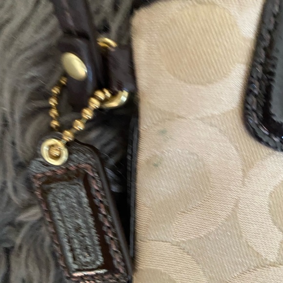 NWOT Coach wristlet with modern “C” on the traditional canvas gold material. - Picture 5 of 5
